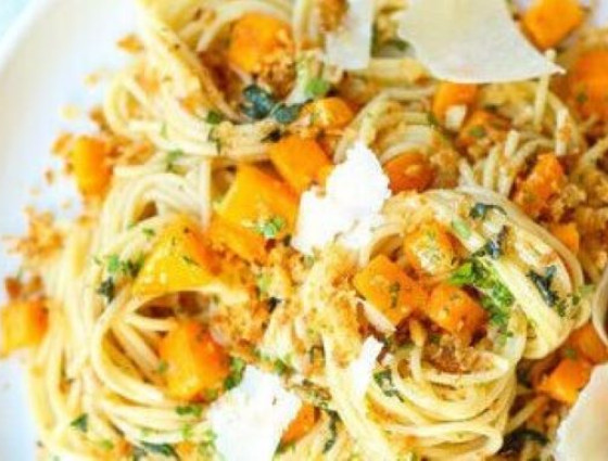 Bowl of spaghetti with cubes of pumpkin & cheese