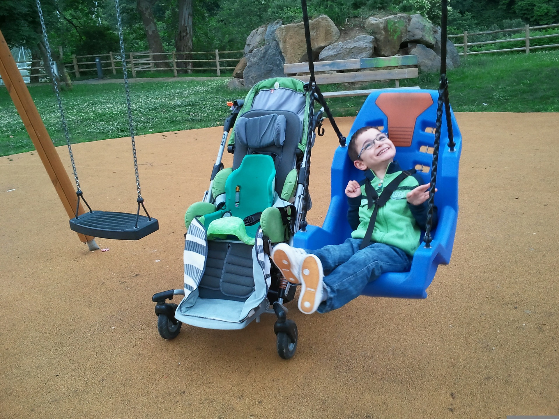 A disabled child in a specially designed swing