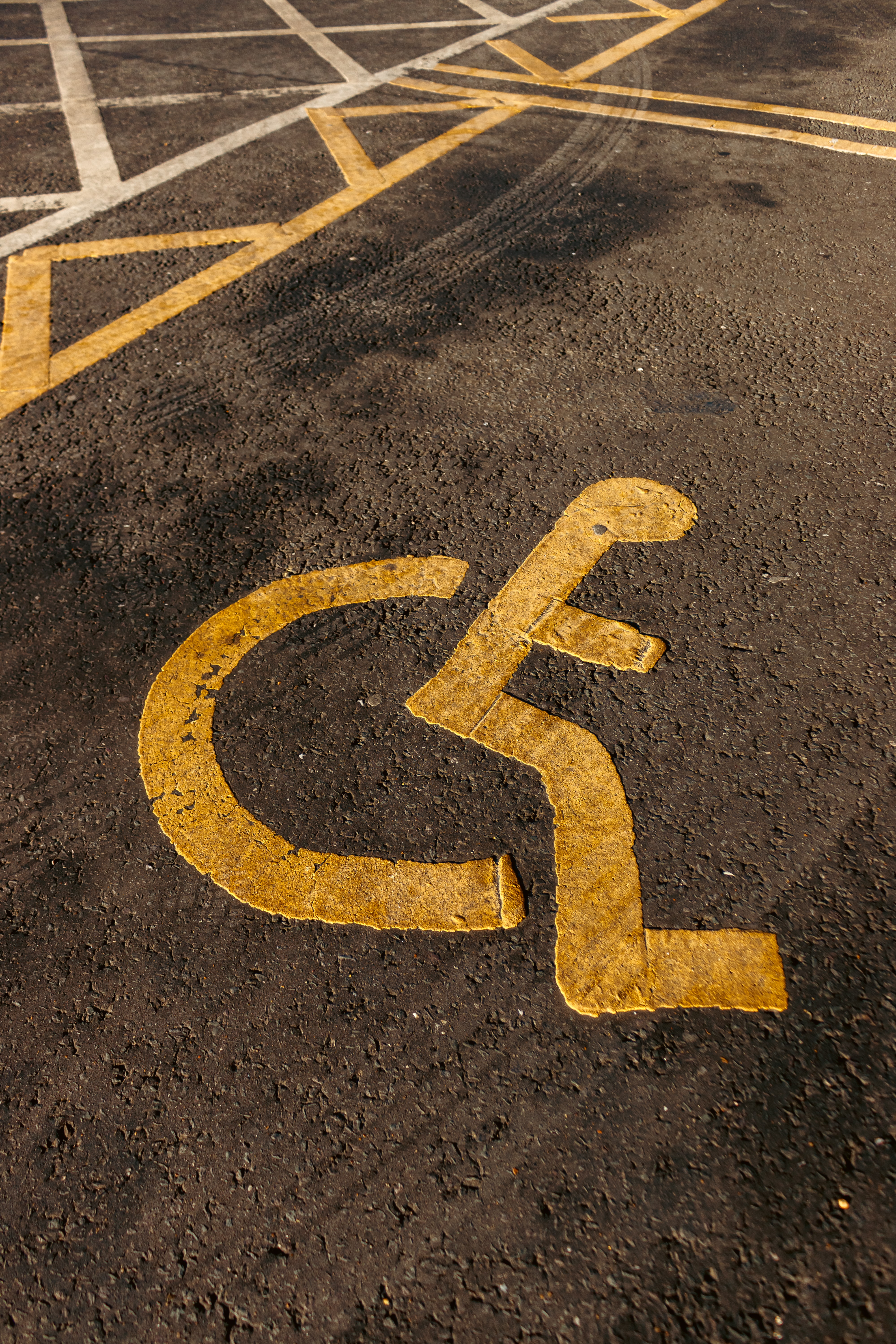 Disabled parking space, with yellow icon 