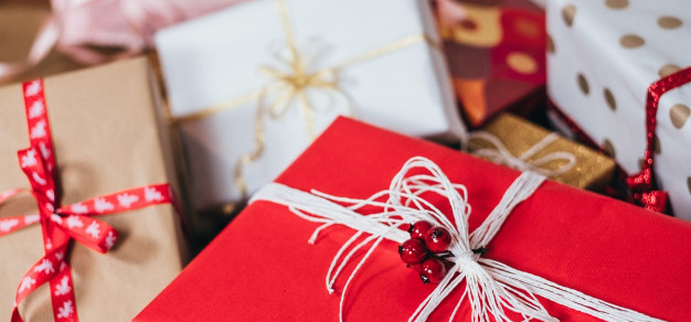 Close up of several red white and gold Christmas presents