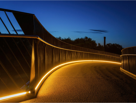 Powick footbridge lit up at night