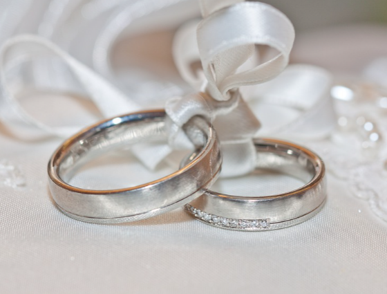 wedding rings tied up with ribbon