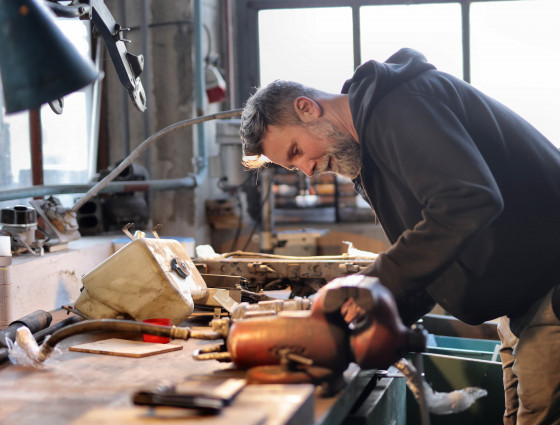 A man repairing items