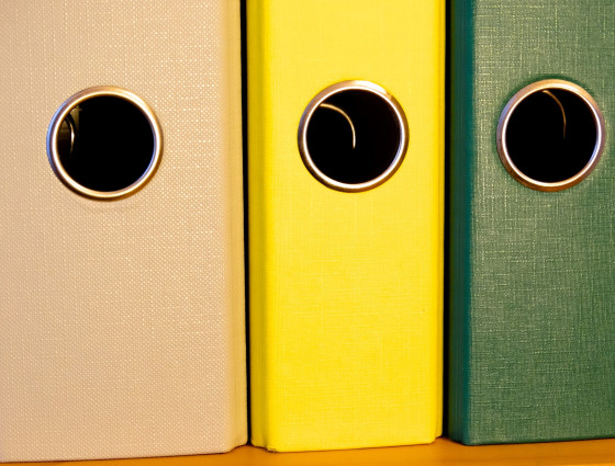 A close up of three ring binder folders