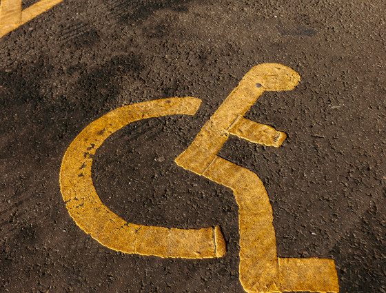 Disabled parking space, with yellow icon 