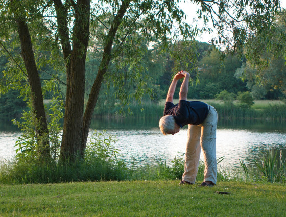 A person bending forward in a yoga position