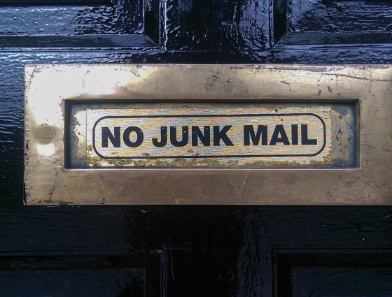 A letter box with the sign no junk mail written on it.