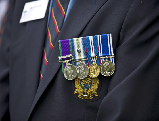 Four medals attached to a jacket