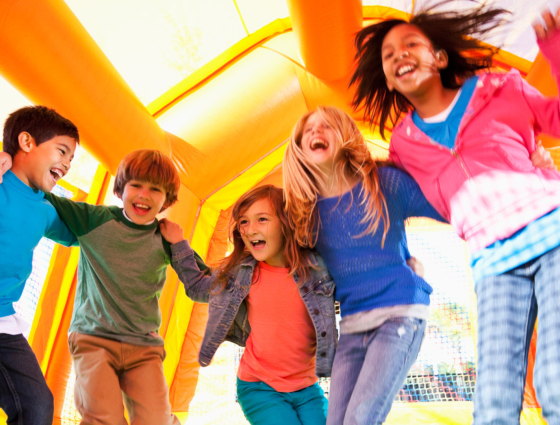 Children jumping on a bouncy castle