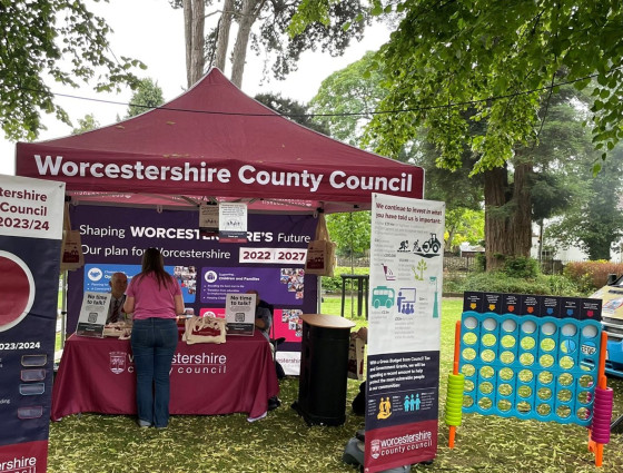 The WCC burgundy roadshow gazebo with banners and connect four game