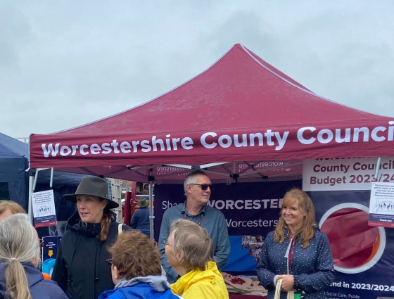 Staff stand behind WCC stand at Tenbury Roadshow 2023