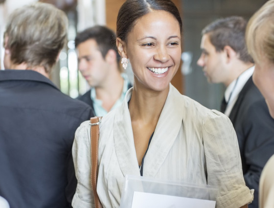 A woman in conversation with a group