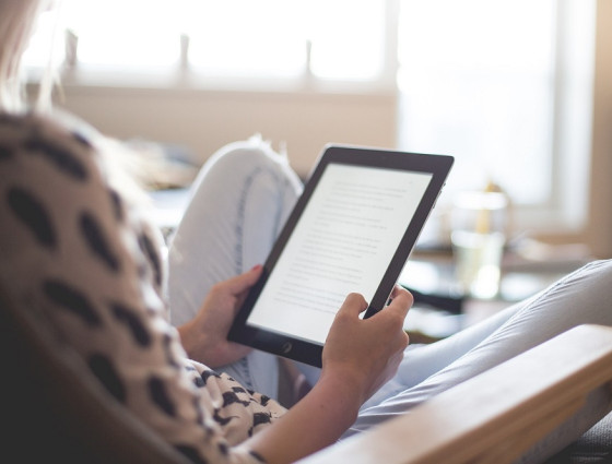 A person reading a kindle