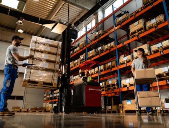 People filling shelves in a warehouse