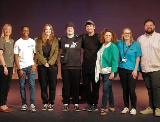 Get Safe Team standing on a theatre stay along with the actors and producers of their new play 'You In?'