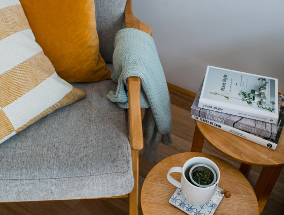 Chair and side table with a cup of tea