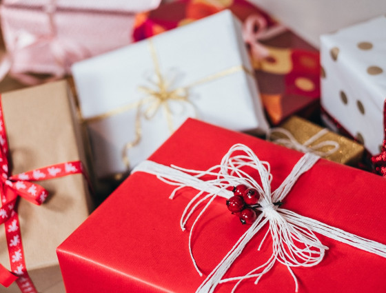 Close up of several red white and gold Christmas presents