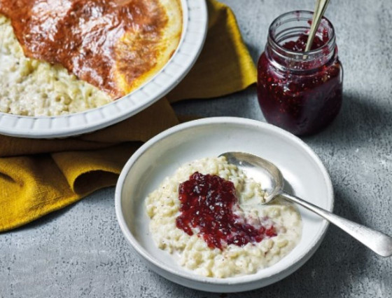 Bowl of rice pudding with jam on top