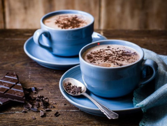 Cups of hot chocolate with chocolate sprinkled on top