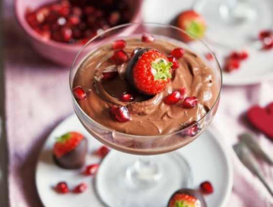 Glass with chocolate mousse topped with a strawberry