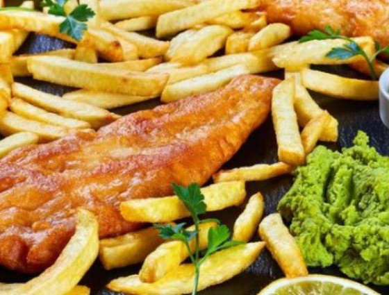 Plate of fish, chips & mushy peas