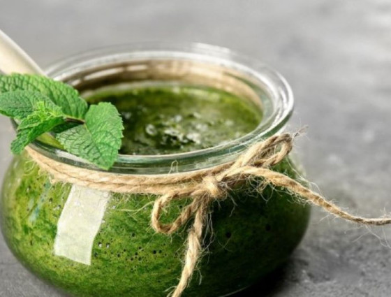 Jar of mint sauce decorated with a mint leaf