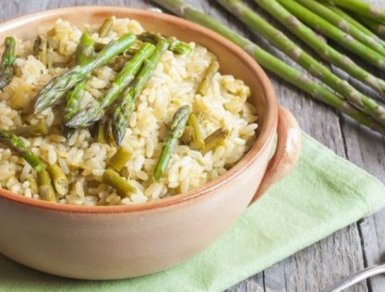 Bowl with risotto garnished with asparagus spears