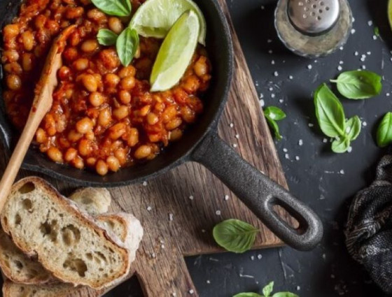 Pan of beans with bread on the side