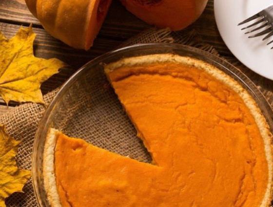 Pumpkin pie with slice taken out