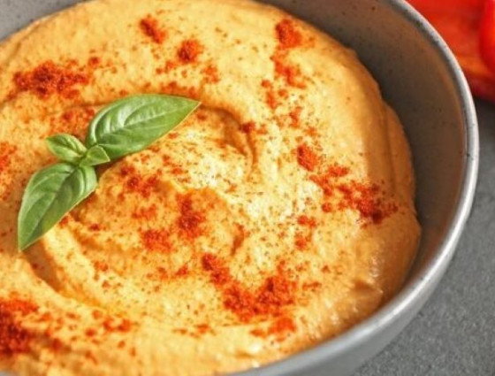 Bowl of hummus with spices on top