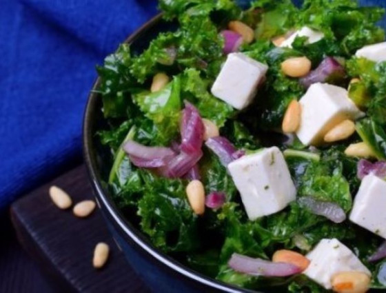 Bowl with kale, tofu squares, onions & pine nuts