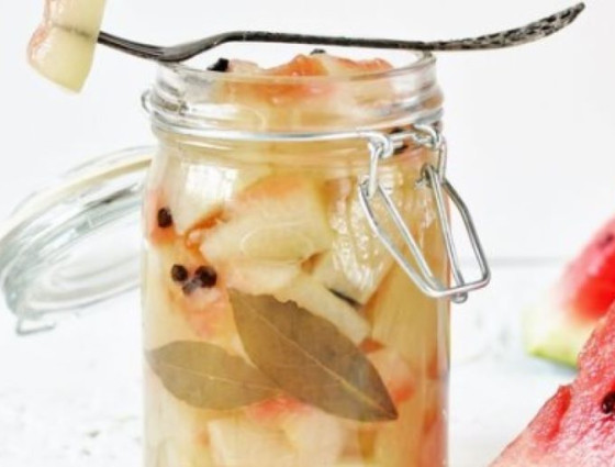 Jar with slices of watermelon rind & herbs