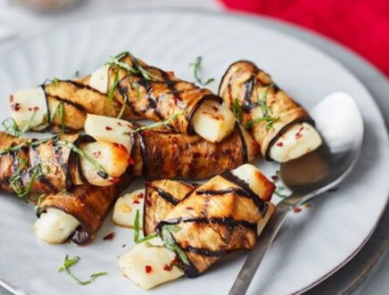 Plate of halloumi wrapped in aubergine slices to recreate pigs in blankets