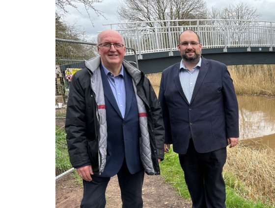 Councillors Morris and Rouse stand alongside the King George Playing Fields footbridge