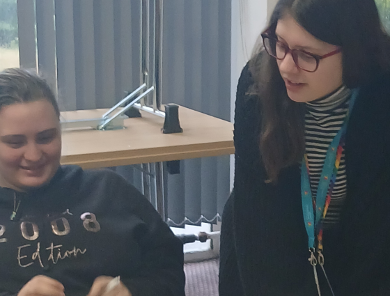 SEND Co-Production Officers chatting with a student