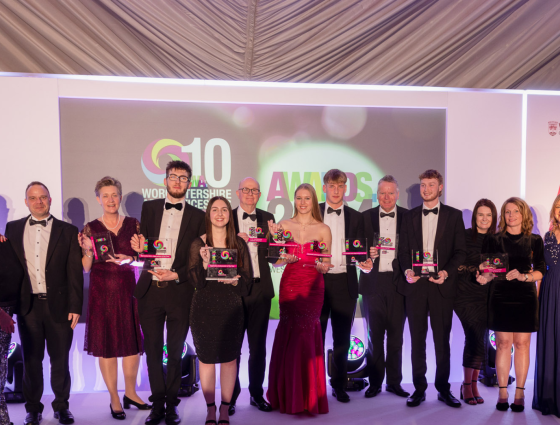 Award winners standing together on stage at the 2024 Apprenticeship Awards