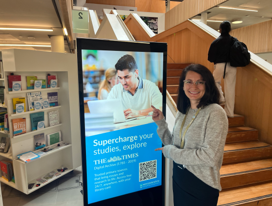 Person pointing at library screen
