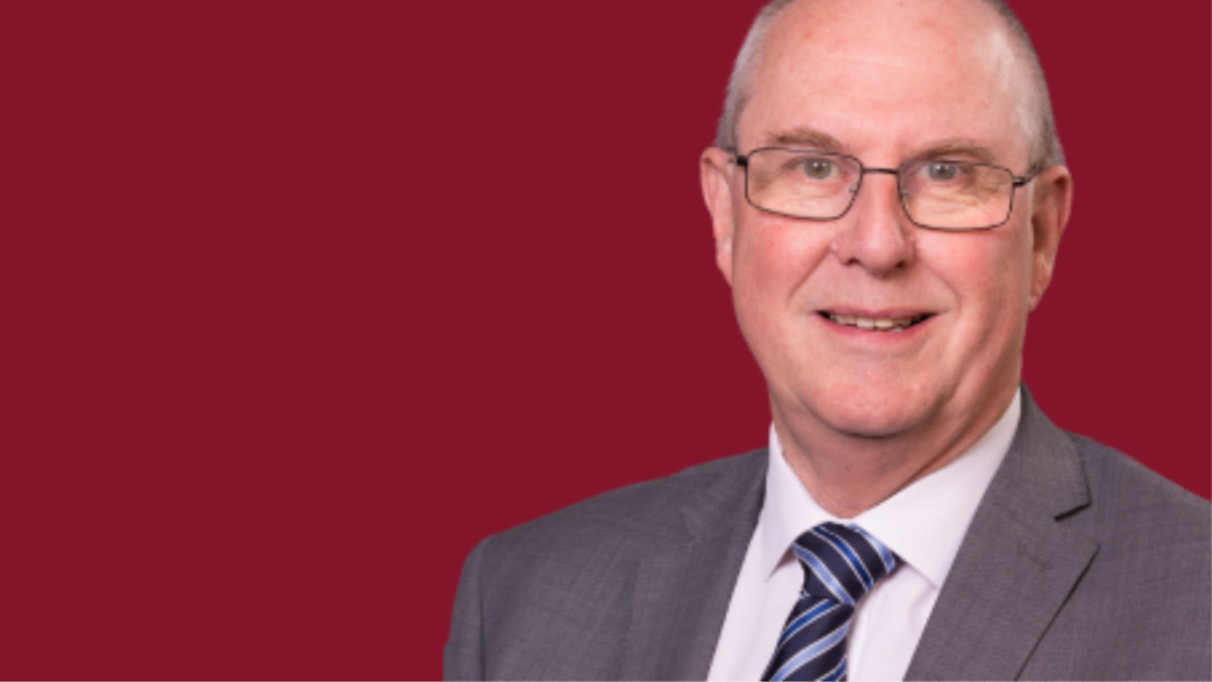 Councillor Steve Mackay on a red background