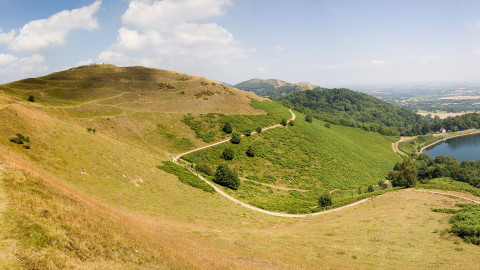 Hills in the countryside with a lake in the far right corner 