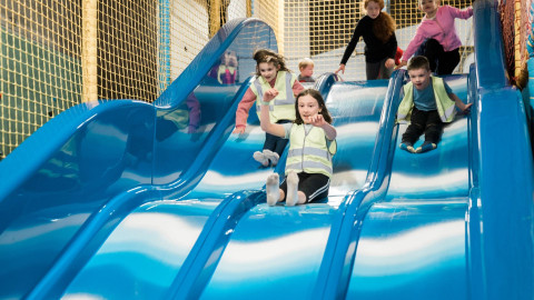 Children going down a slide