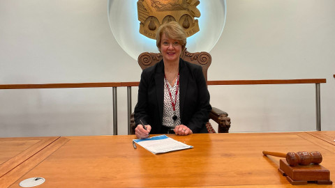 Cllr Karen May signing stay connected pledge