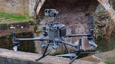 Drone inspecting bridge
