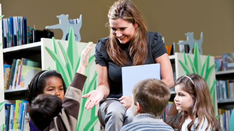woman reading to children