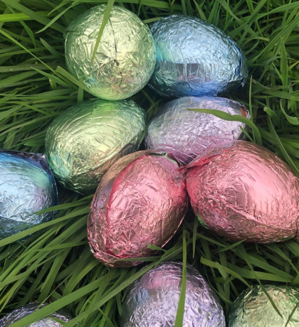 shiny easter eggs on a bed of grass.