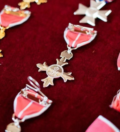 Honours medals laid out on red cloth