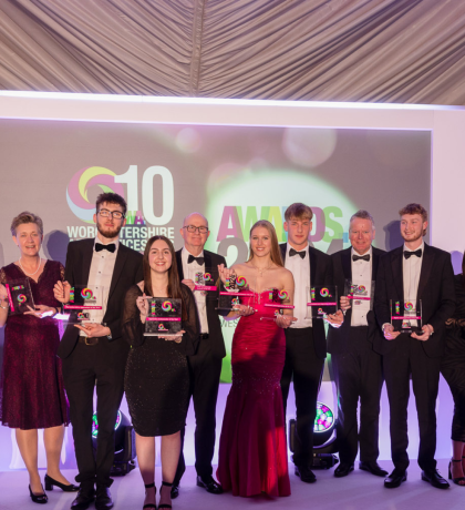 Award winners standing together on stage at the 2024 Apprenticeship Awards