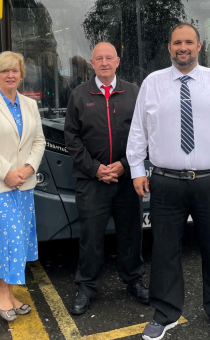 David Bradford and Andy Lunn from National Express standing next to a bus with councillors Mike Rouse and Karen May.  