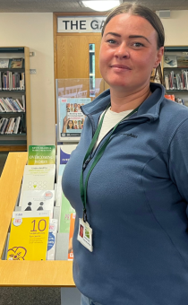 Rae-Anne Preece, Lead Youth Worker for the Detached Project standing in Droitwich Library during Libraries Unlocked hours. 