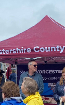 Staff stand behind WCC stand at Tenbury Roadshow 2023