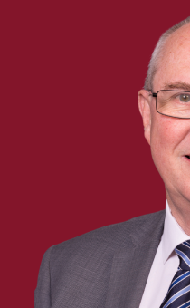 Photograph of Cllr Steve Mackay superimposed onto a burgundy background